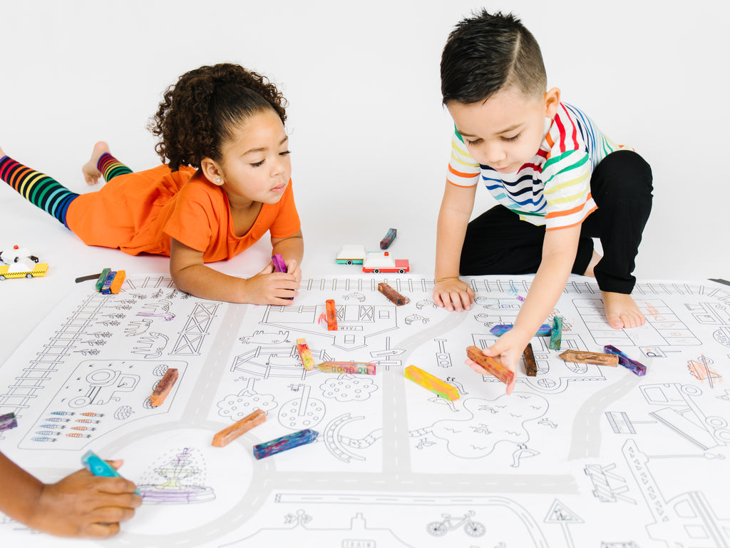children coloring on a giant coloring page