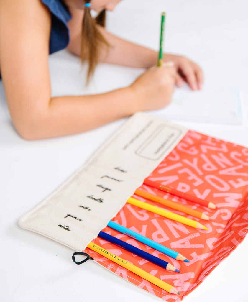 girl drawing with pencil