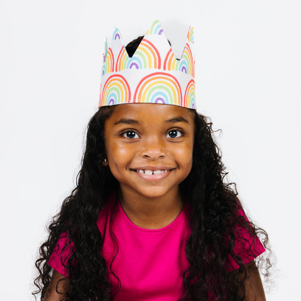 girl wearing rainbow crown