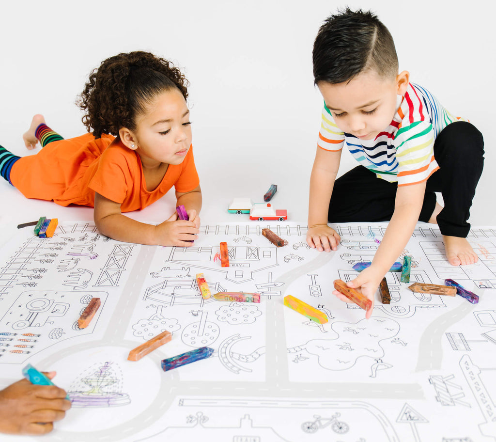 kids coloring a giant coloring page