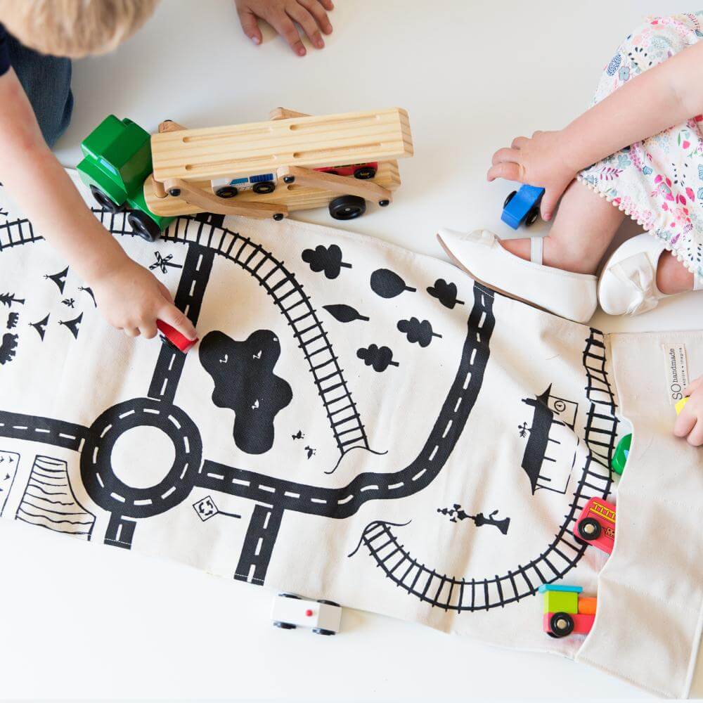 kids playing with large play mat