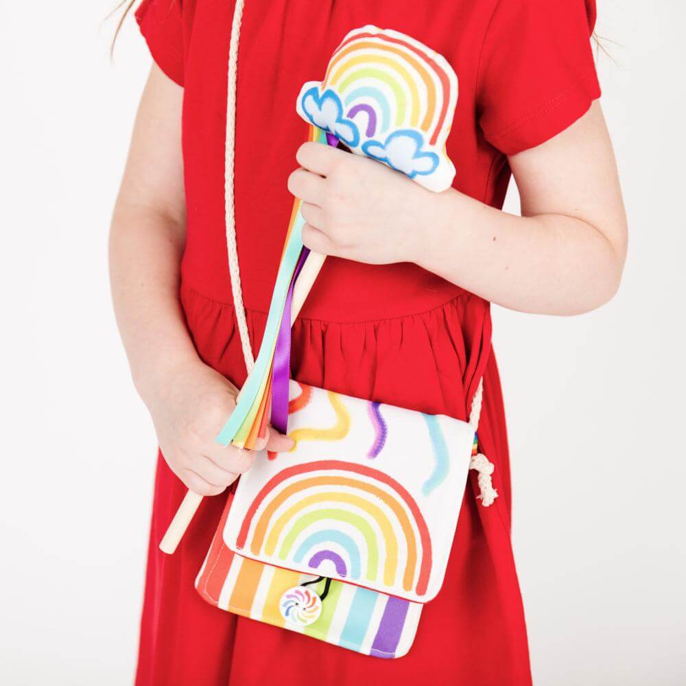 girl holding rainbow gifts